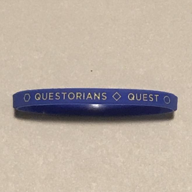 Dark blue silicone wrist band with Questorians Quest logo