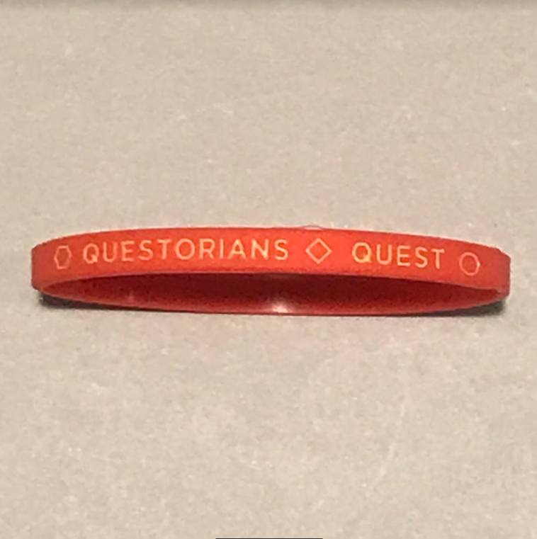 Orange Silicone wrist band with Questorians Quest logo